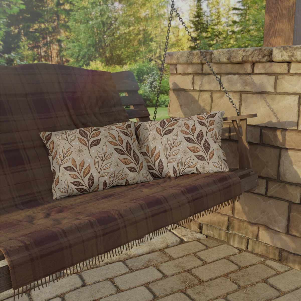 Brown leaf sprig lumbar outdoor pillow — spun polyester, UV and water resistant