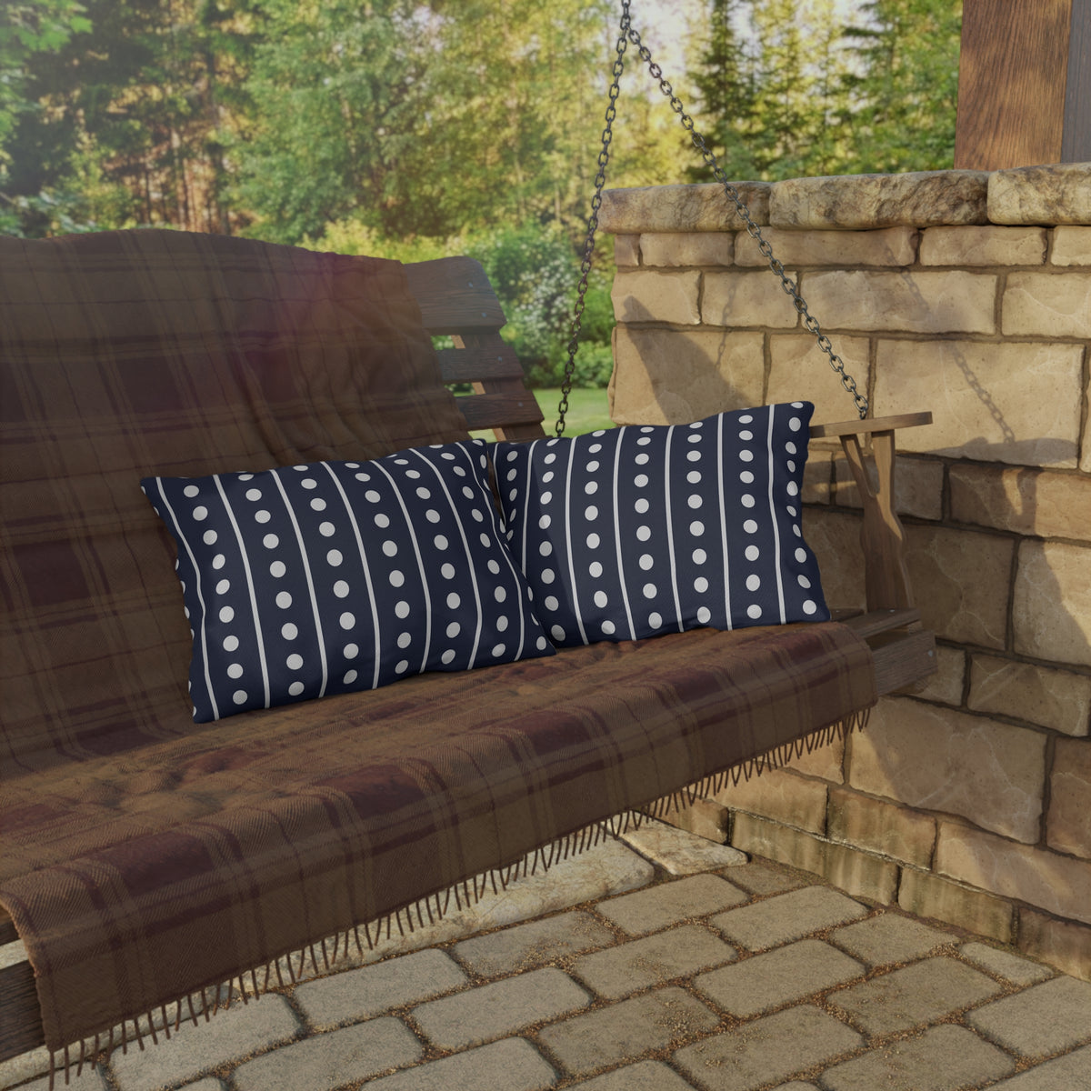 Navy and white dot stripe lumbar outdoor pillow — spun polyester, UV and water resistant