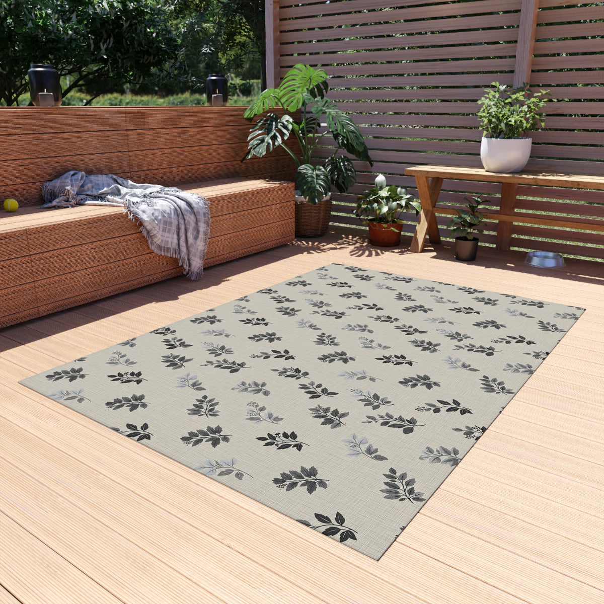 Charcoal leaf sprig outdoor rug — soft polyester chenille with a non-slip backing
