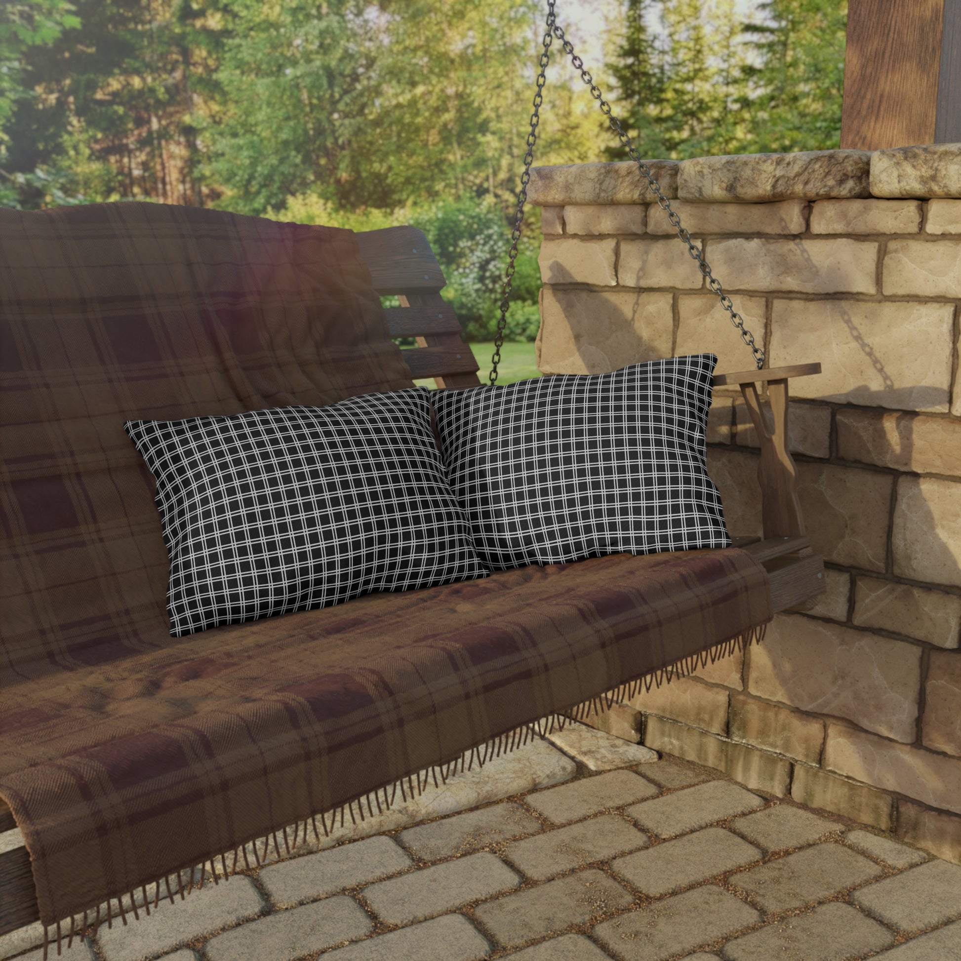 Black and white checkered outdoor pillow — spun polyester, UV and water resistant