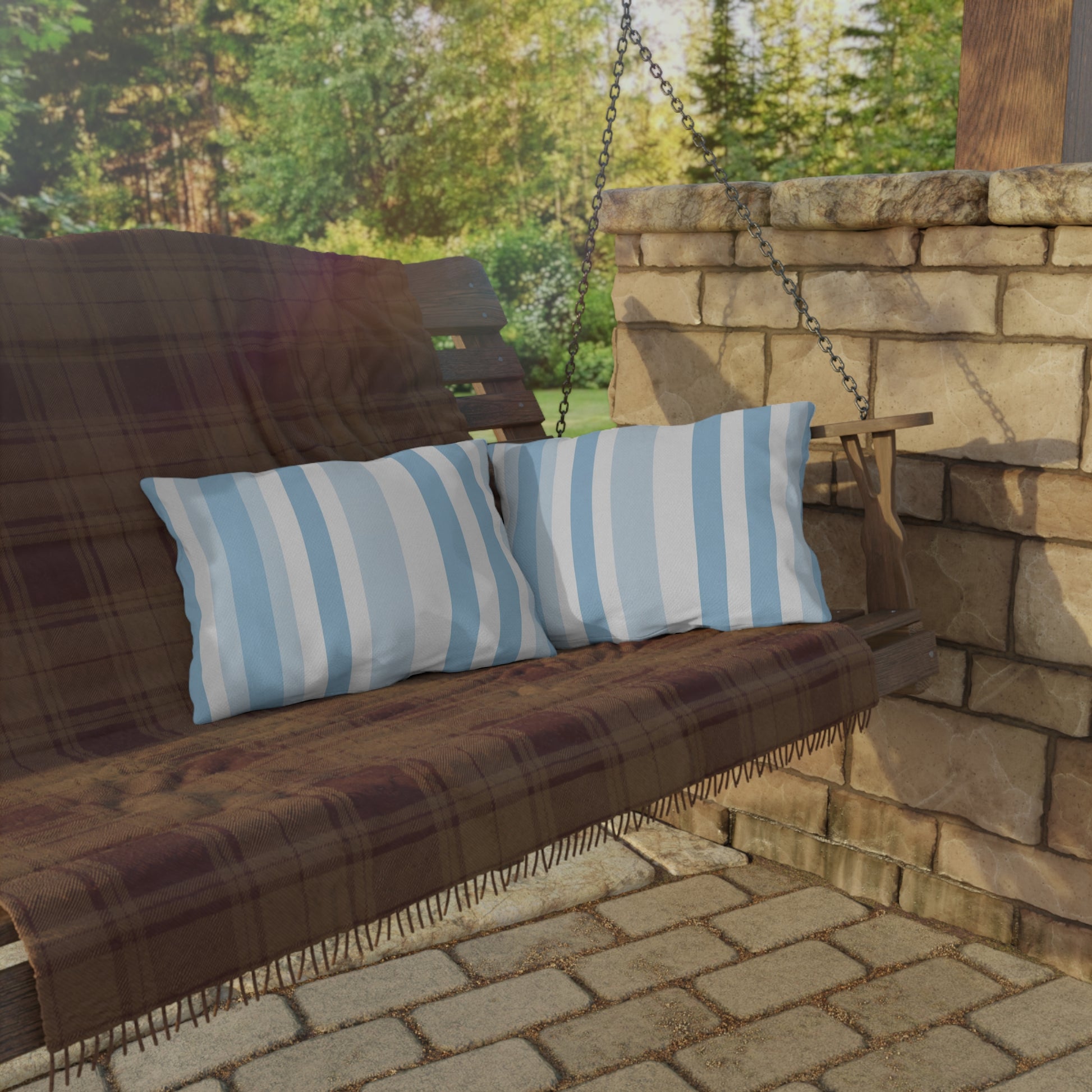 Blue and white striped outdoor pillow — spun polyester, UV and water resistant