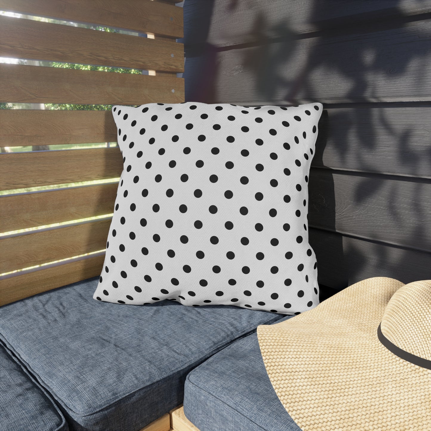 Black and white polka dot outdoor pillow — spun polyester, UV and water resistant