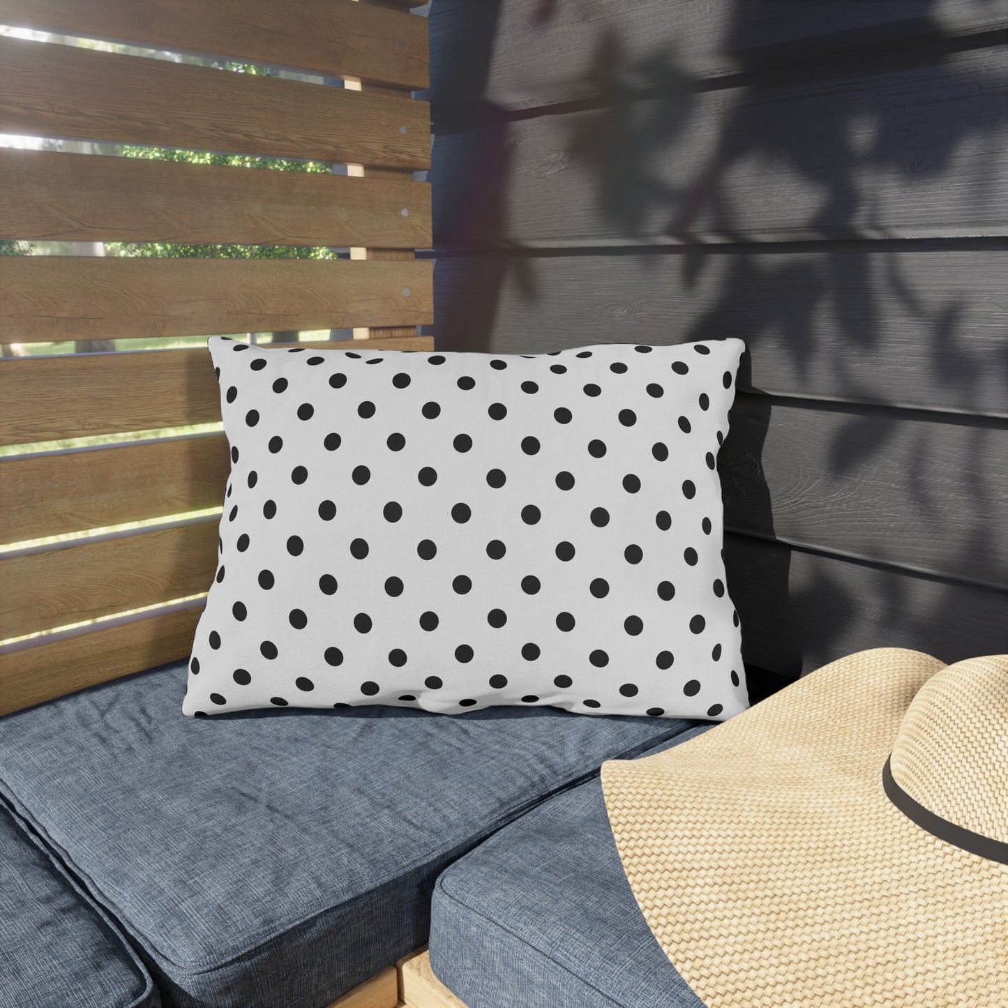 Black and white polka dot outdoor pillow — spun polyester, UV and water resistant