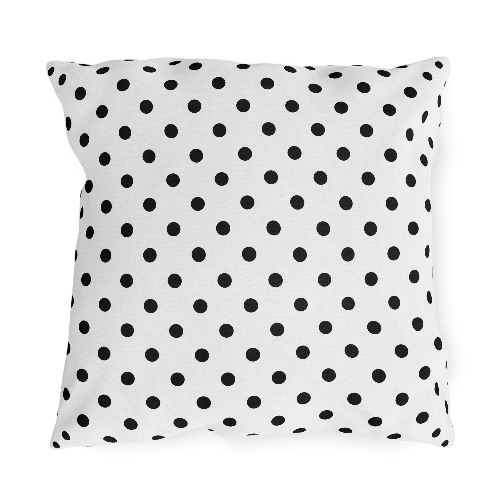 Black and white polka dot outdoor pillow — spun polyester, UV and water resistant