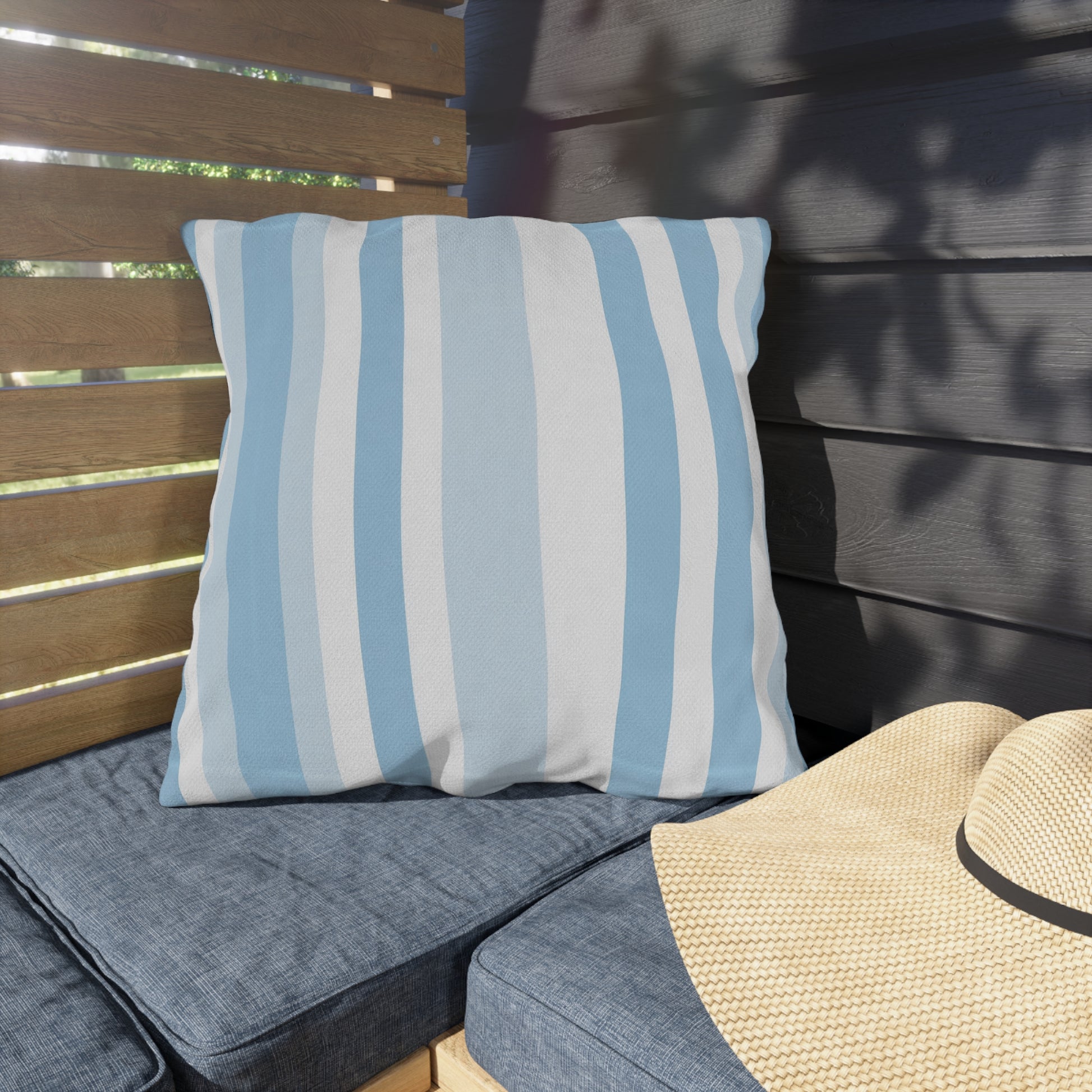 Blue and white striped outdoor pillow — spun polyester, UV and water resistant