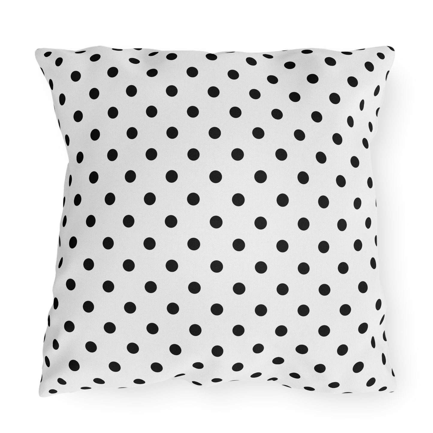 Black and white polka dot outdoor pillow — spun polyester, UV and water resistant