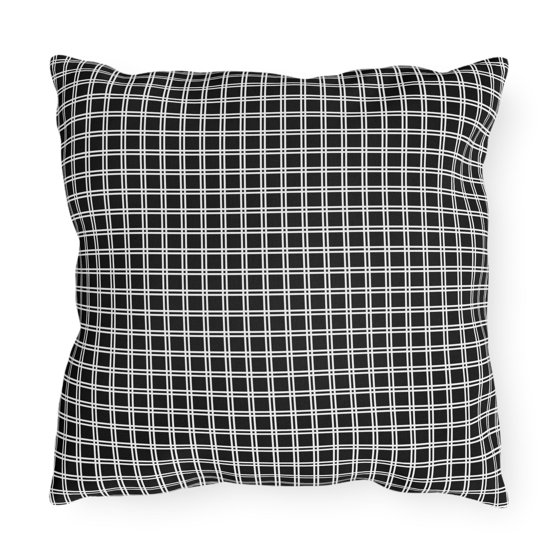 Black and white checkered outdoor pillow — spun polyester, UV and water resistant