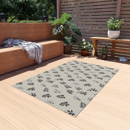 Charcoal leaf sprig outdoor rug — soft polyester chenille with a non-slip backing