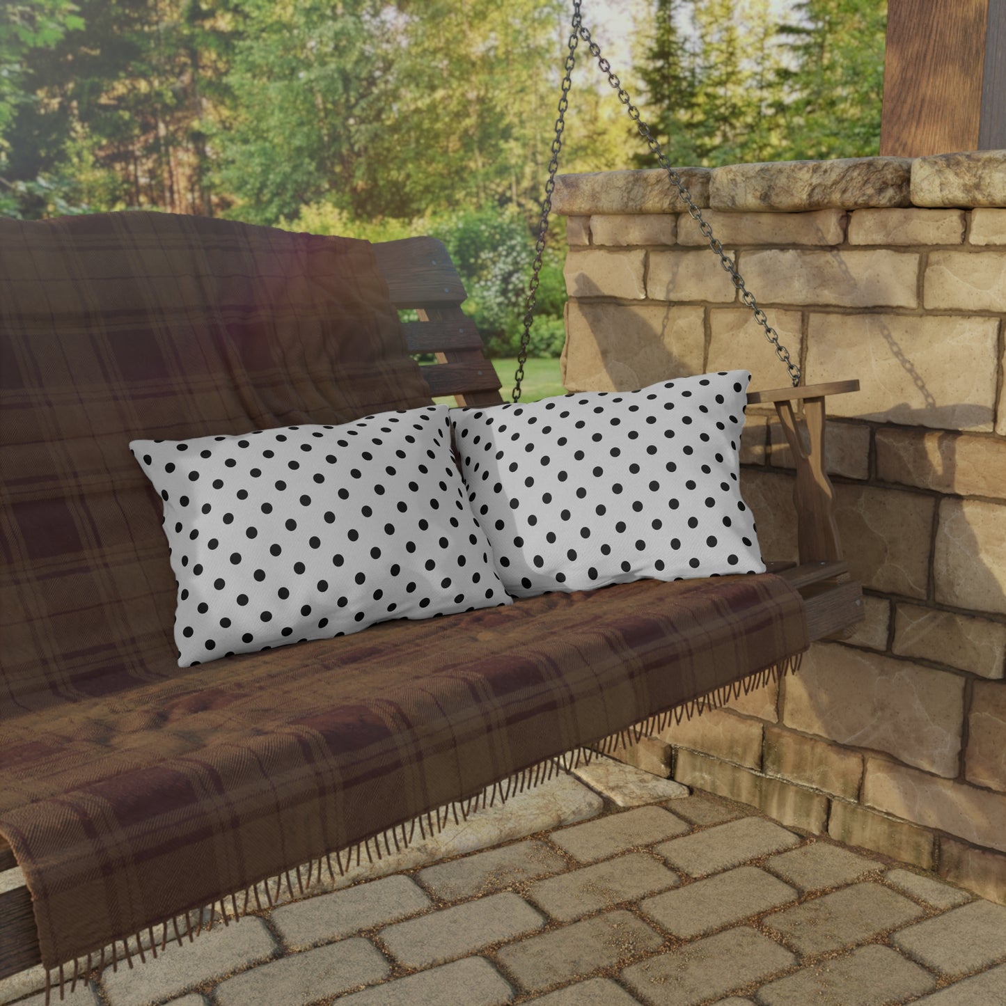 Black and white polka dot outdoor pillow — spun polyester, UV and water resistant