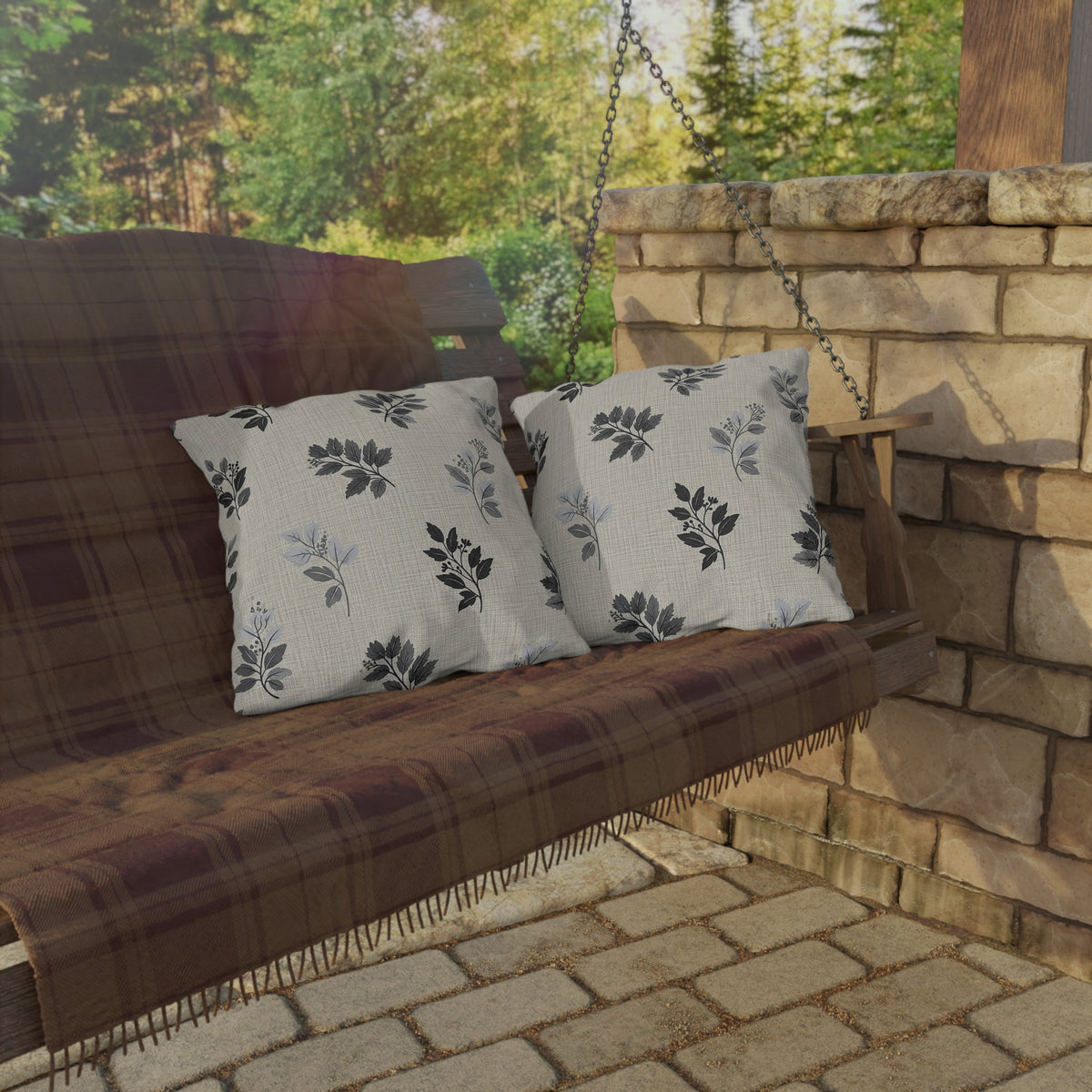 Charcoal leaf sprig outdoor pillow — spun polyester, UV and water resistant
