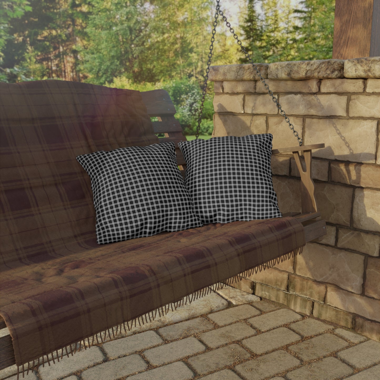 Black and white checkered outdoor pillow — spun polyester, UV and water resistant