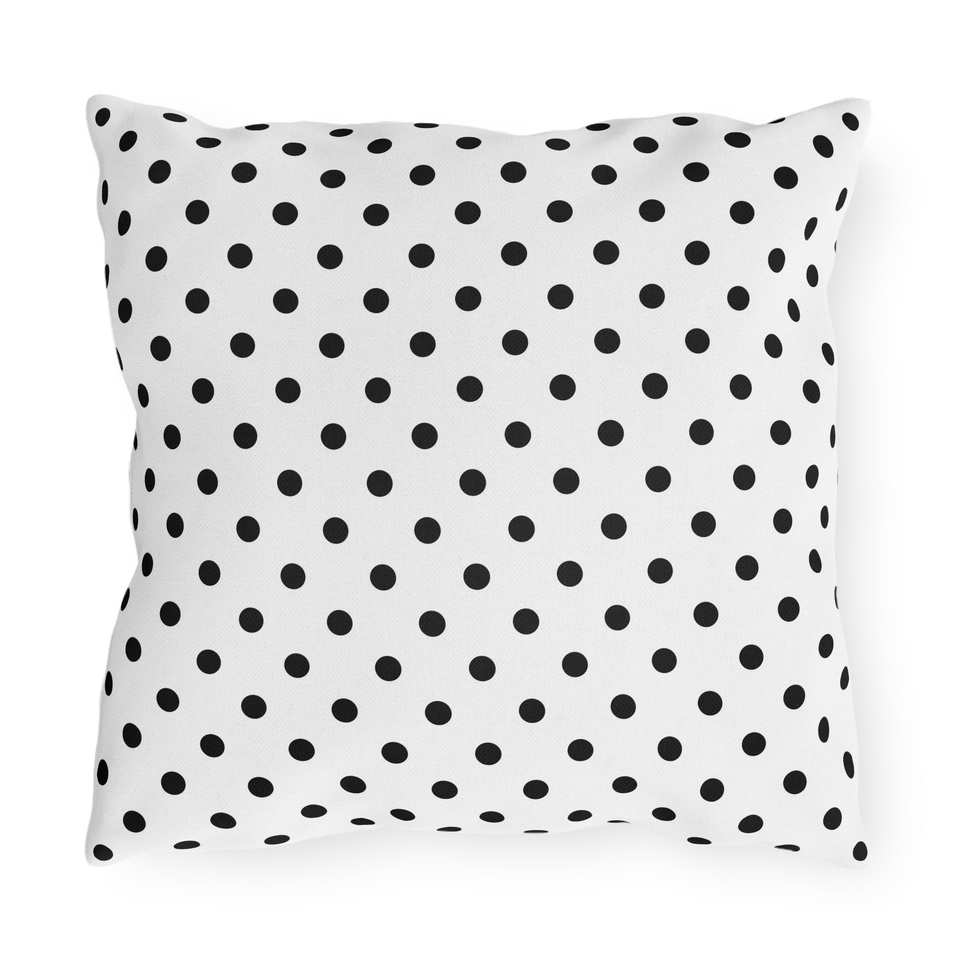 Black and white polka dot outdoor pillow — spun polyester, UV and water resistant