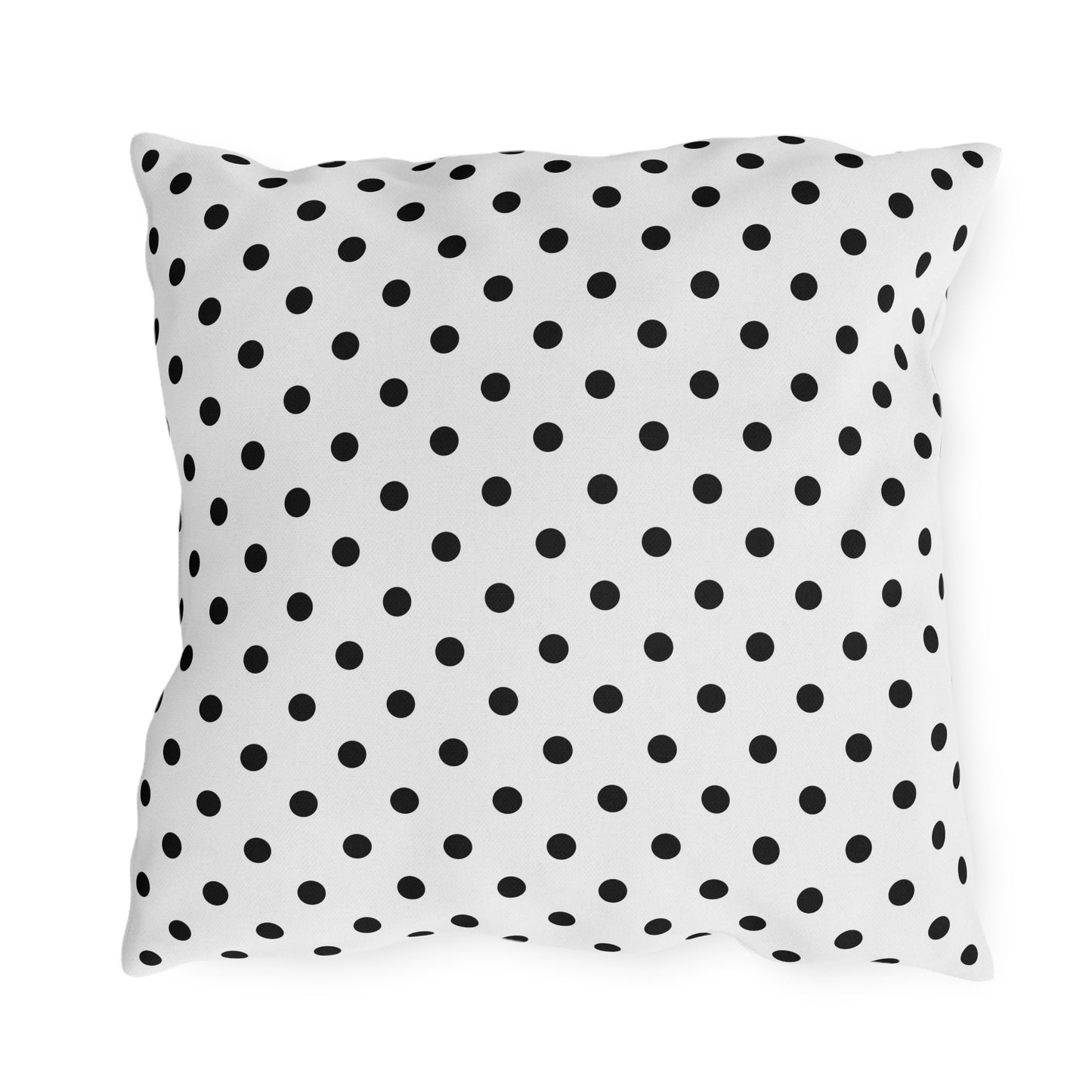 Black and white polka dot outdoor pillow — spun polyester, UV and water resistant