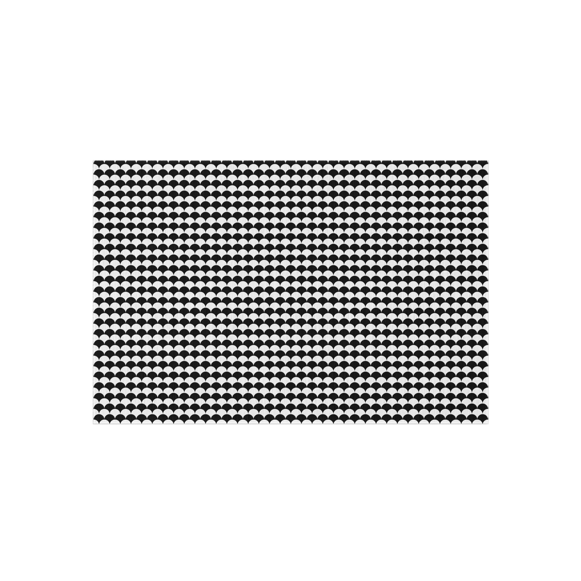 Black and white scallop outdoor rug — soft polyester chenille with a non-slip backing