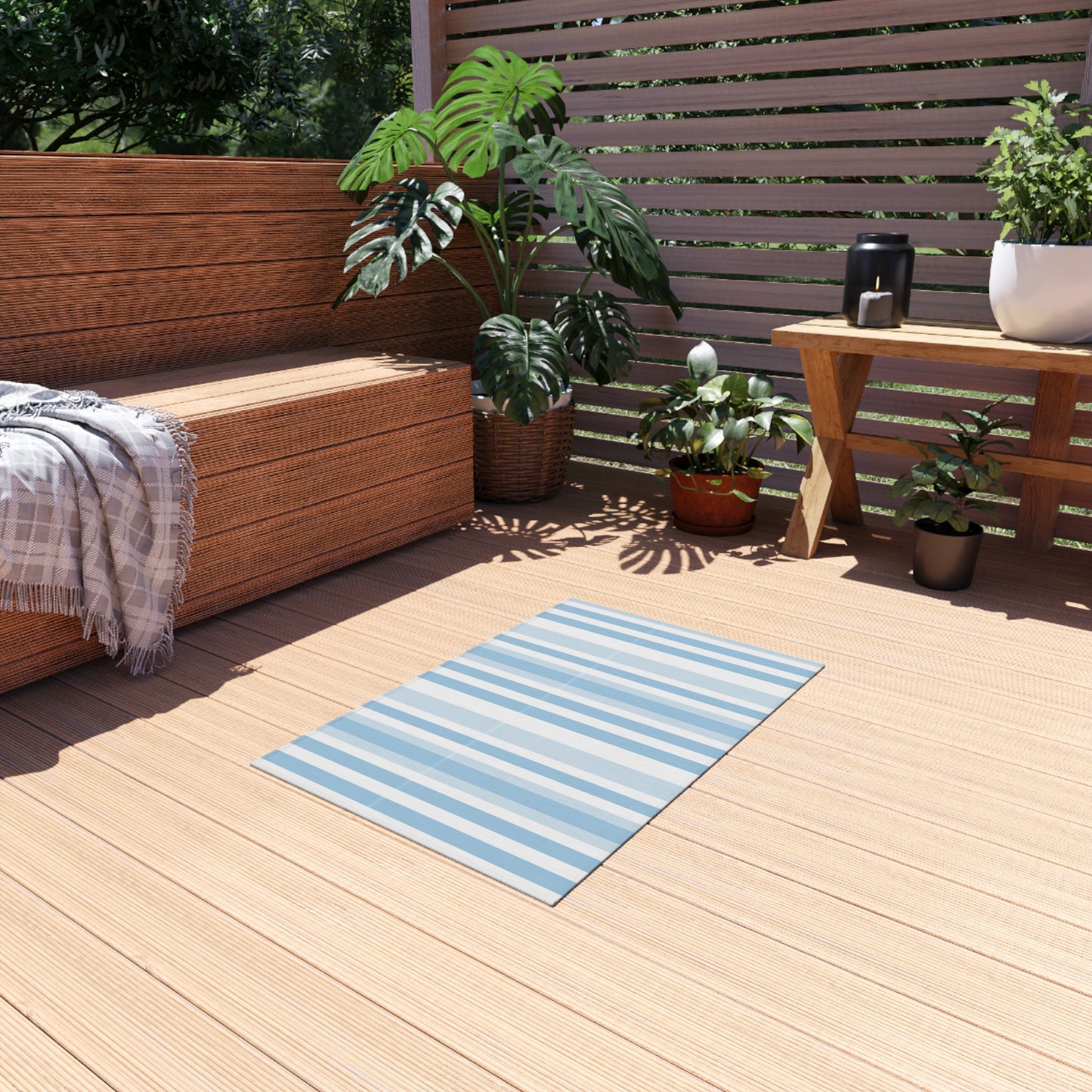 Blue and white striped outdoor rug — soft polyester chenille with a non-slip backing