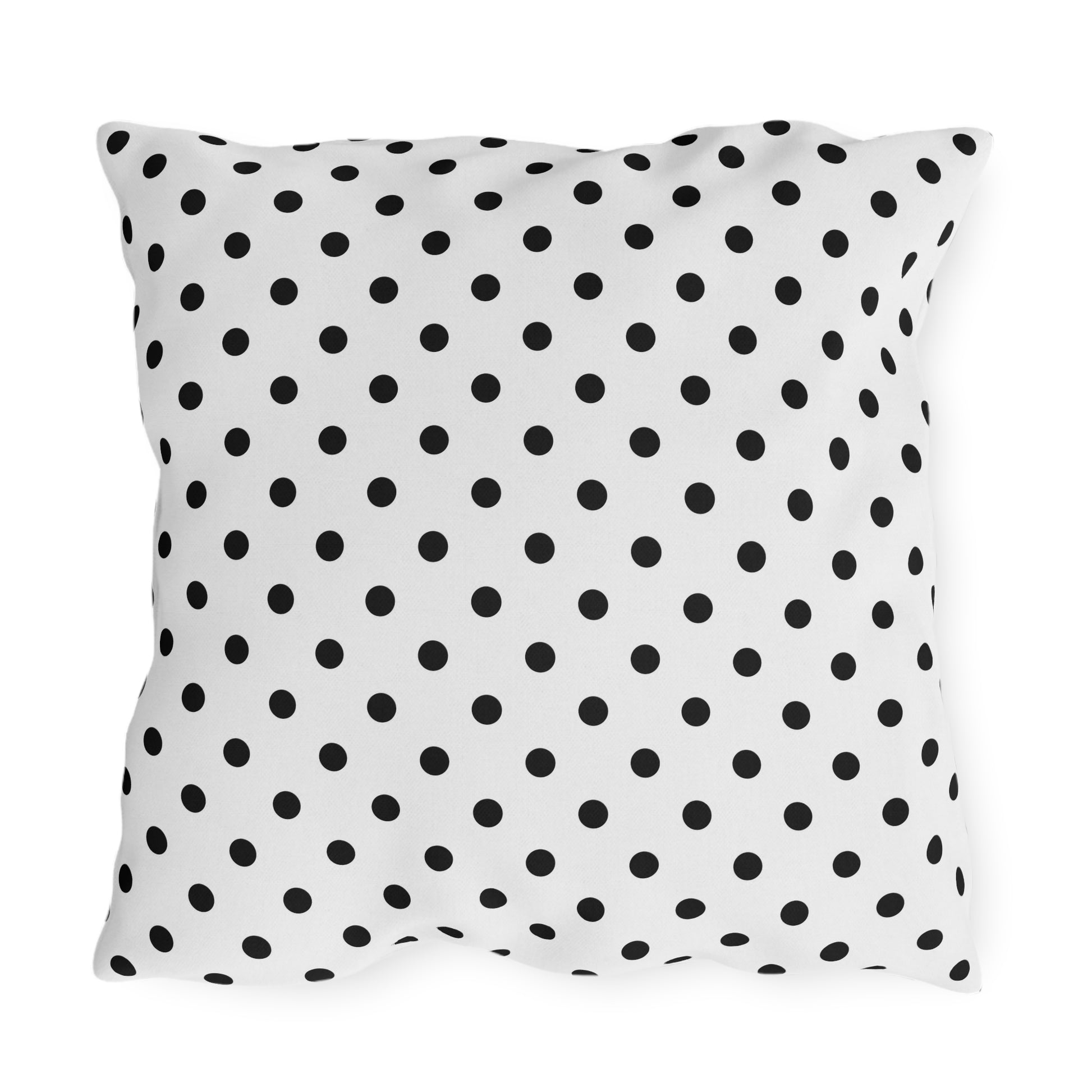 Black and white polka dot outdoor pillow — spun polyester, UV and water resistant