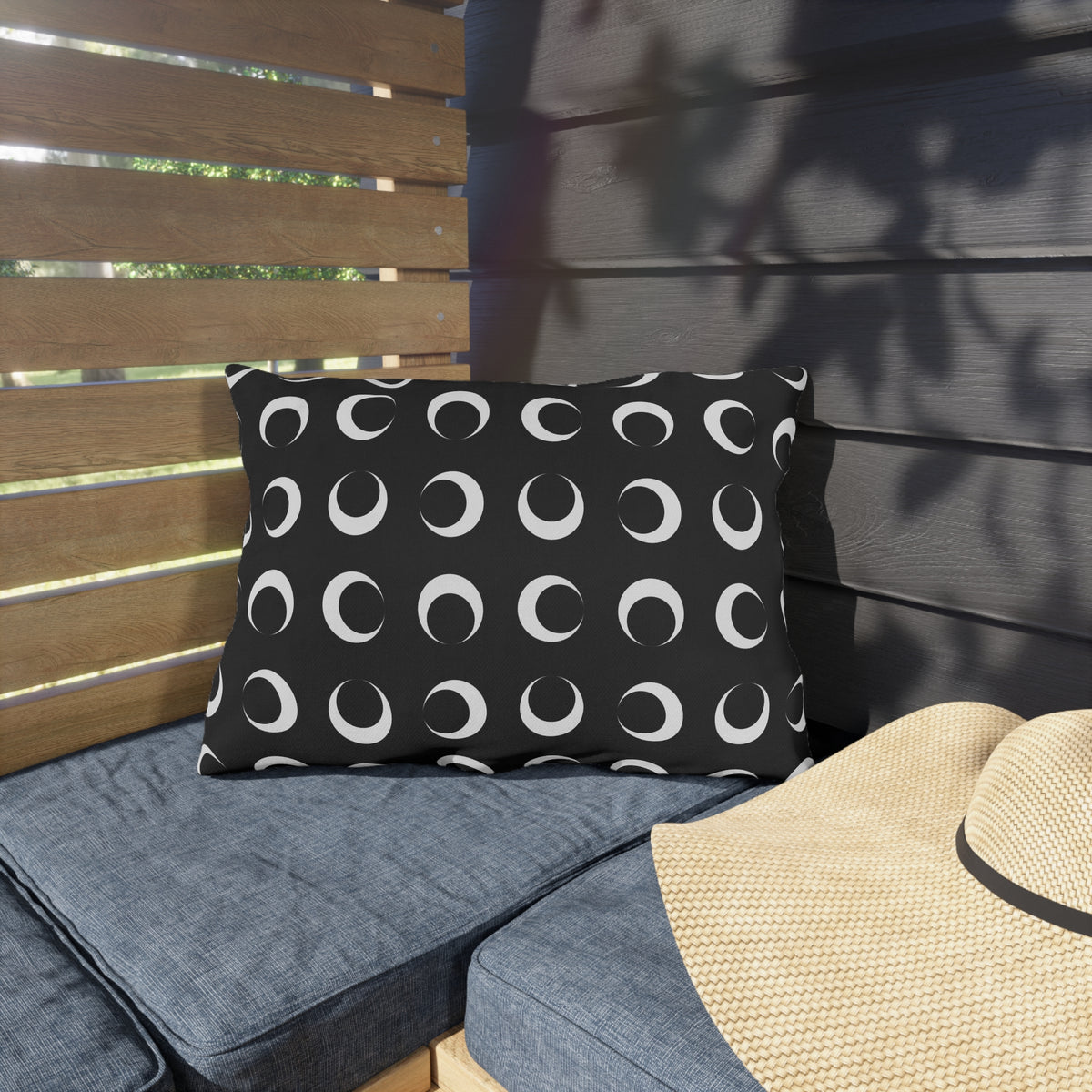 Black crescent moon lumbar outdoor pillow — spun polyester, UV and water resistant