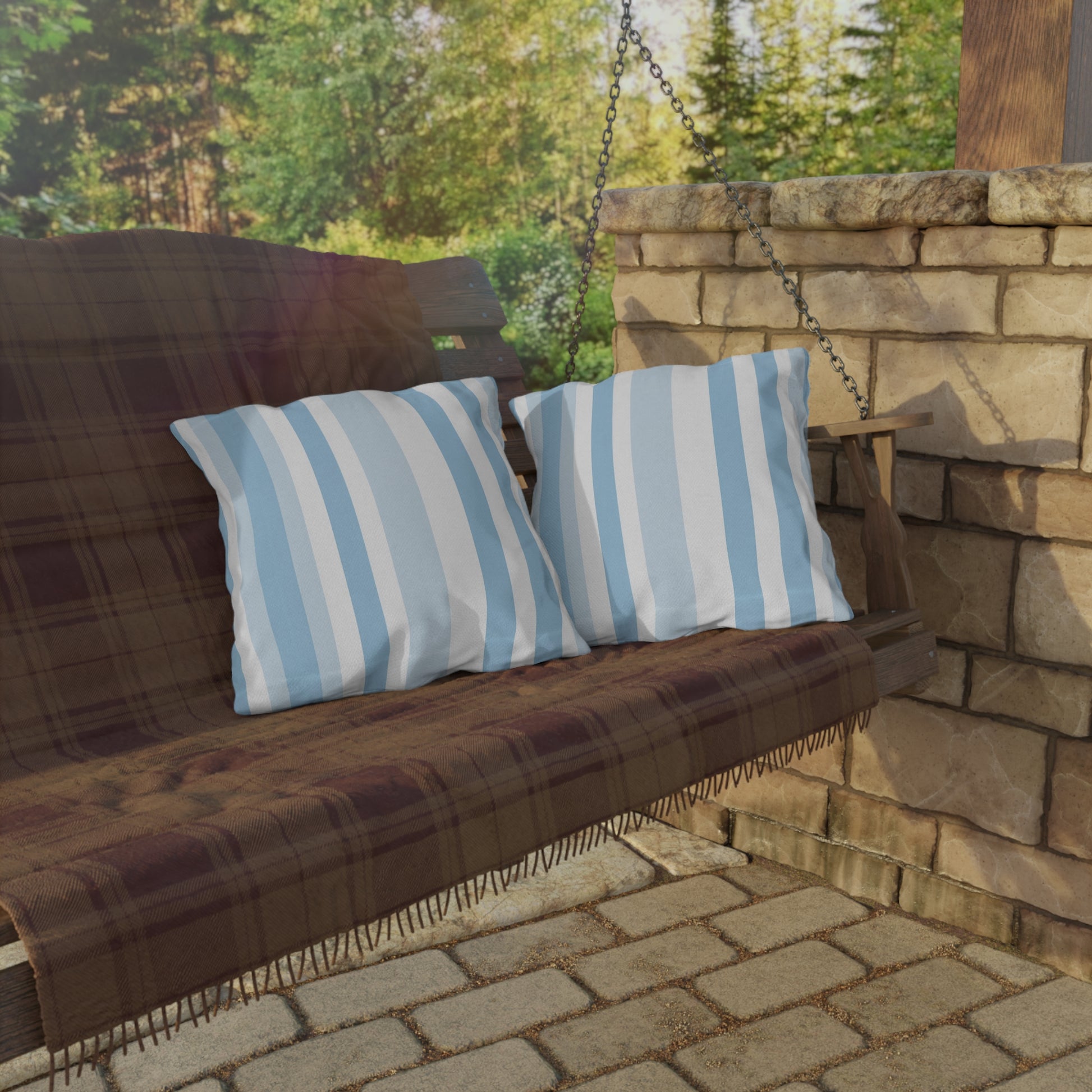Blue and white striped outdoor pillow — spun polyester, UV and water resistant