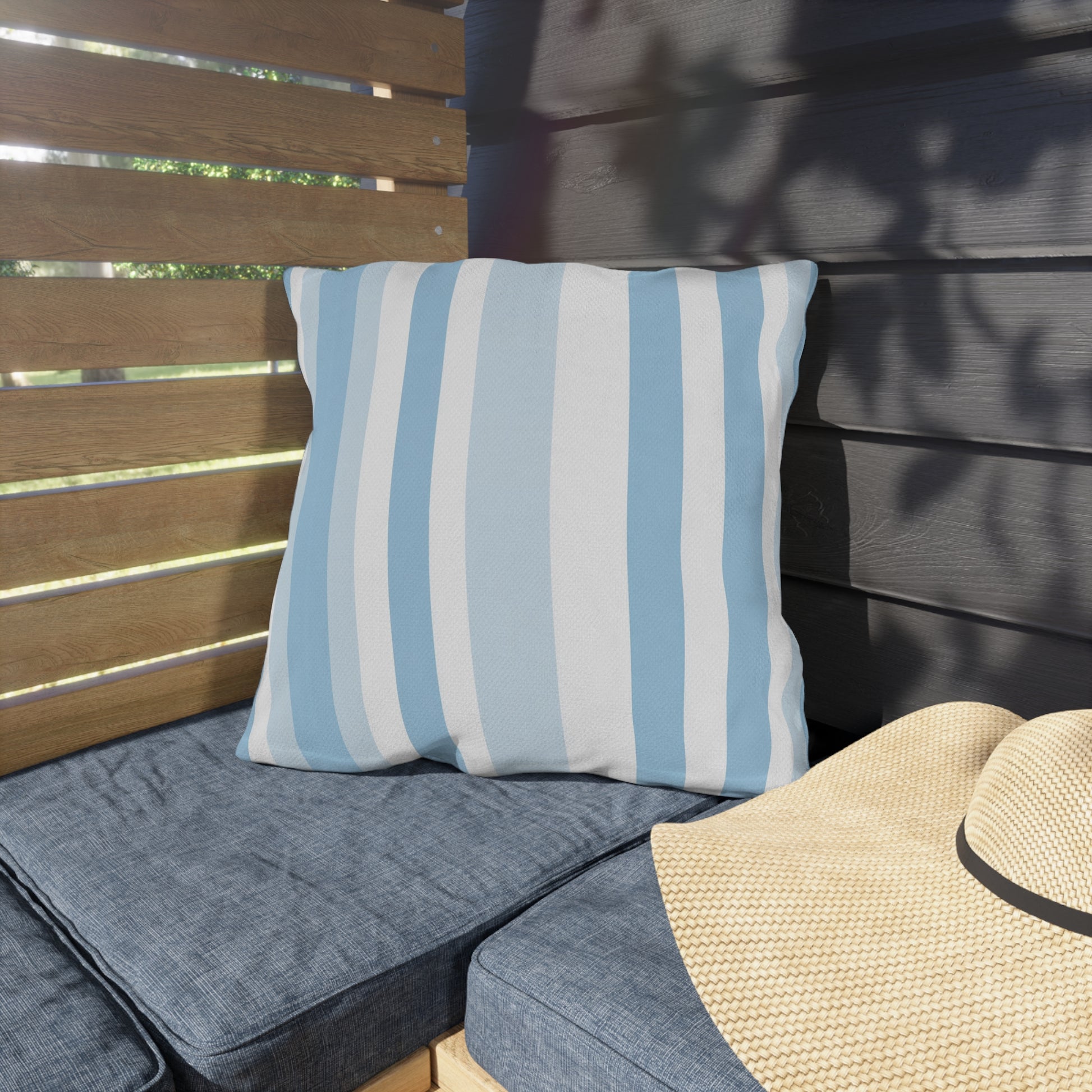 Blue and white striped outdoor pillow — spun polyester, UV and water resistant