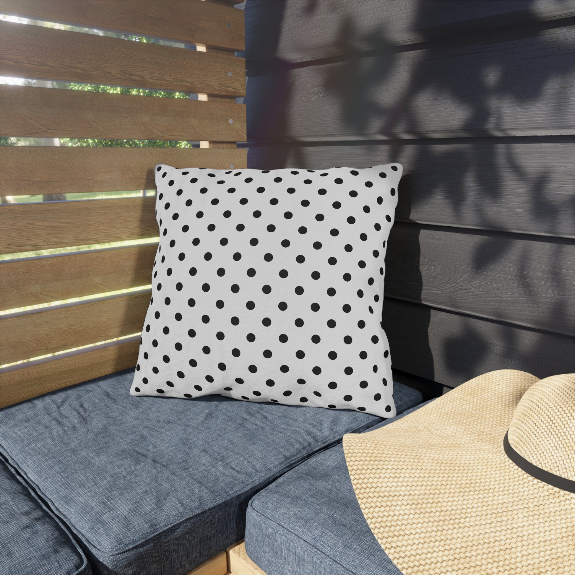 Black and white polka dot outdoor pillow — spun polyester, UV and water resistant