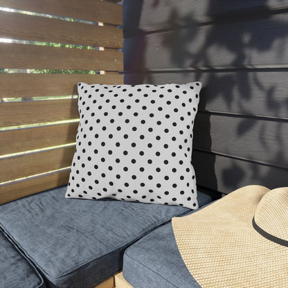 Black and white polka dot outdoor pillow — spun polyester, UV and water resistant