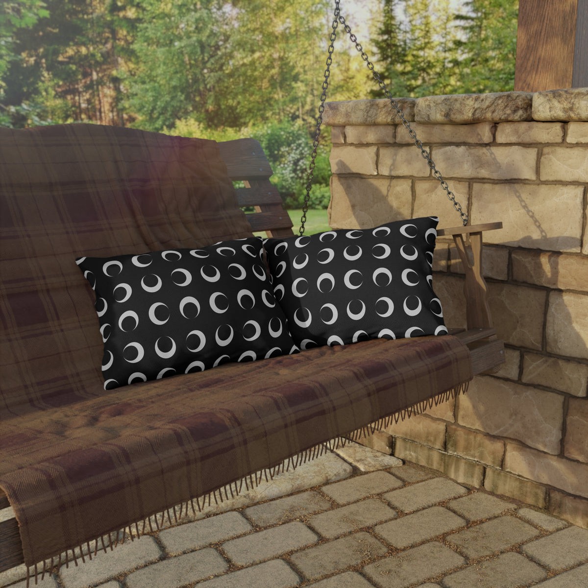 Black crescent moon lumbar outdoor pillow — spun polyester, UV and water resistant