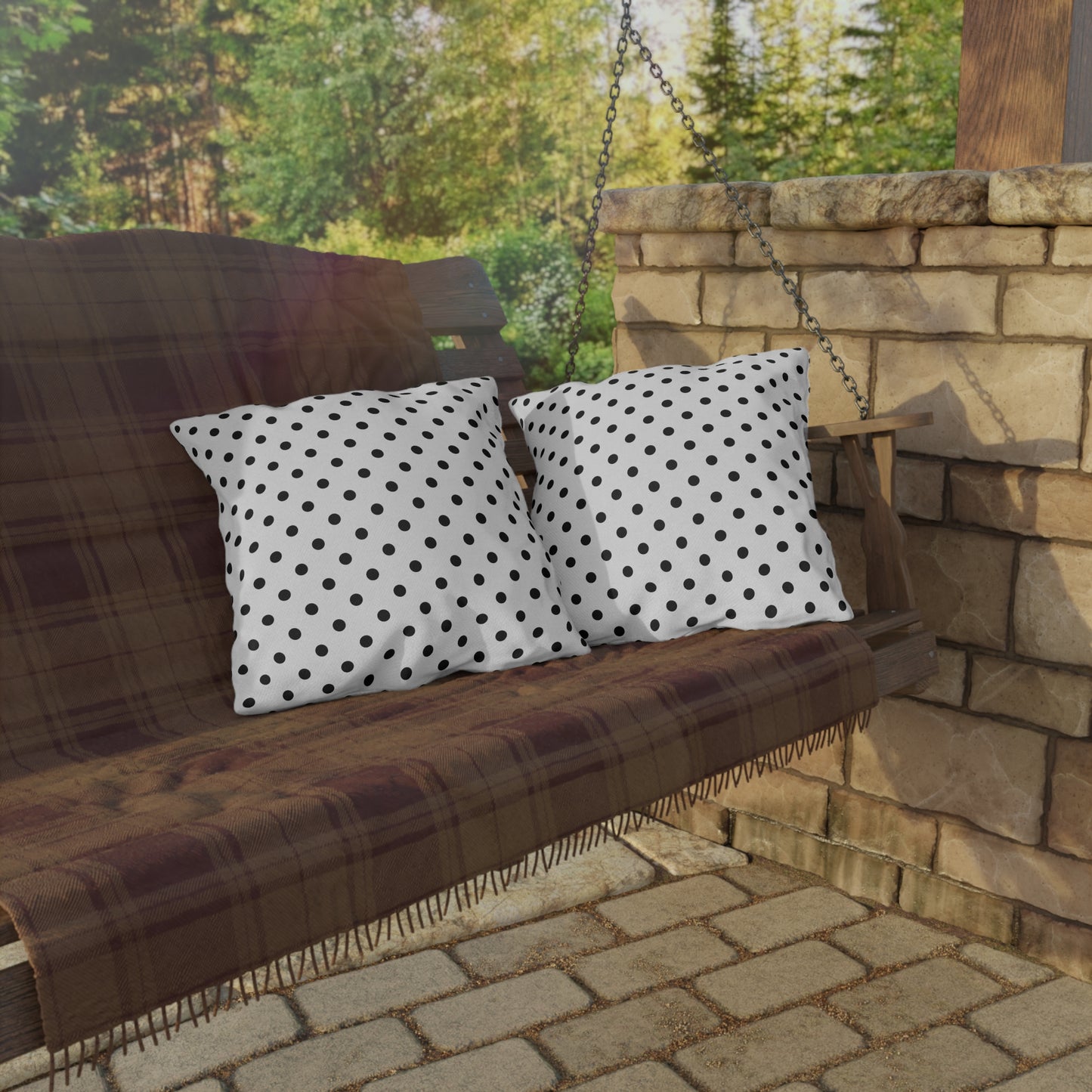 Black and white polka dot outdoor pillow — spun polyester, UV and water resistant