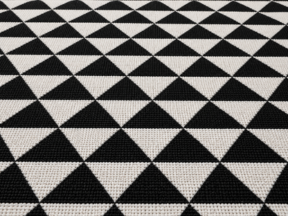 Black and white quilt triangle outdoor rug — soft polyester chenille with a non-slip backing