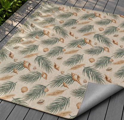 Green palm and shell outdoor rug — soft polyester chenille with a non-slip backing