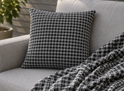 Black and white checkered outdoor pillow — spun polyester, UV and water resistant