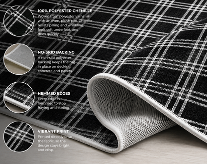 Close-up of the black and white checkered outdoor rug — soft polyester chenille pile