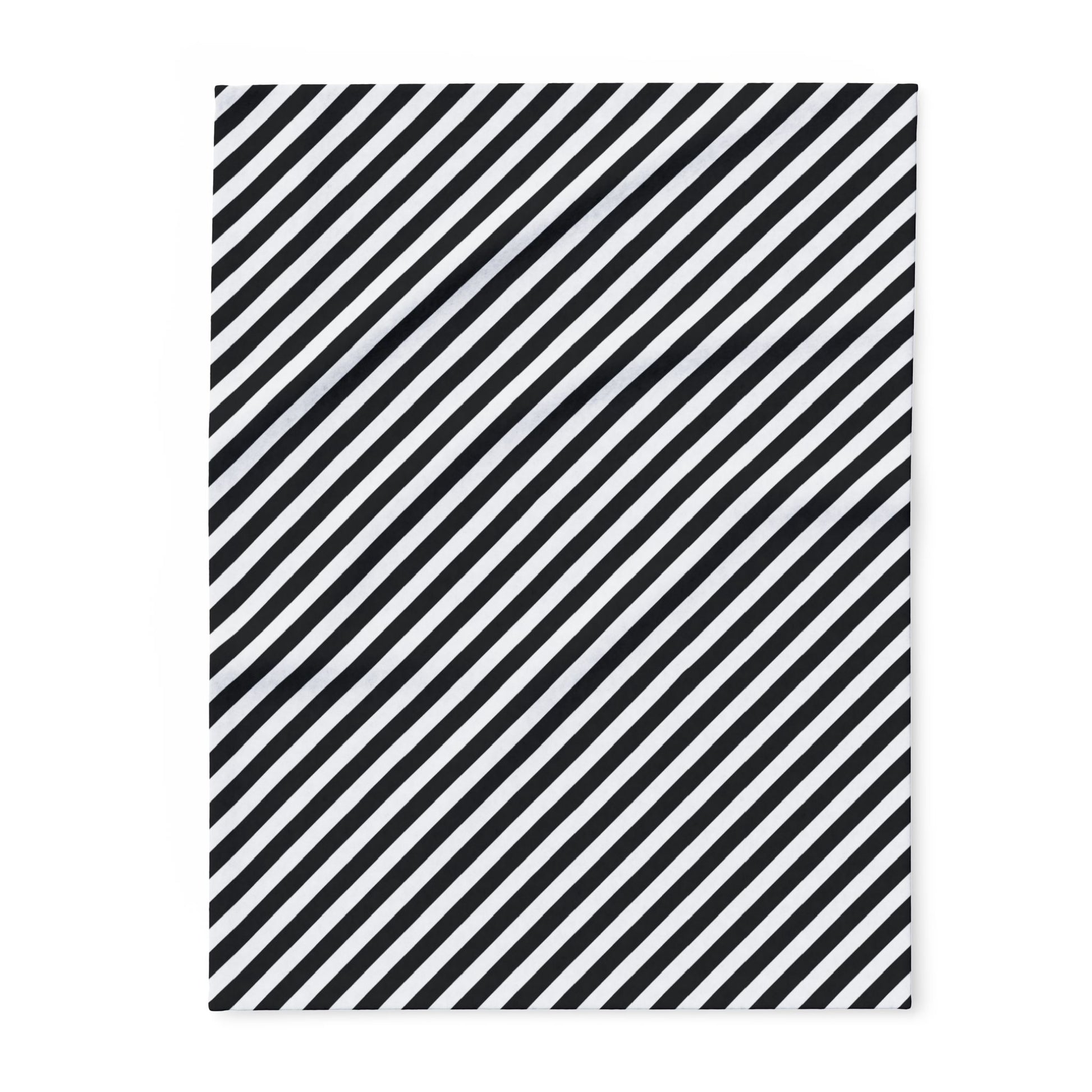 Black and white diagonal striped fleece blanket, folded flat — quick-drying 315gsm polyester throw for fire pits and porches