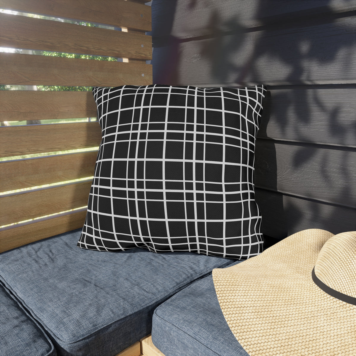 Black windowpane grid outdoor pillow — spun polyester, UV and water resistant