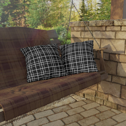 Black windowpane grid outdoor pillow — spun polyester, UV and water resistant