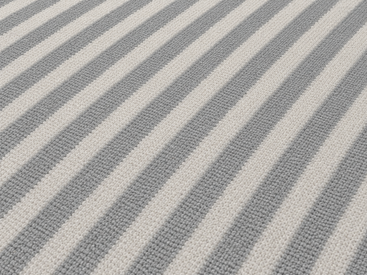 Close-up of the grey diagonal stripe outdoor rug — short, dense low-pile chenille nap
