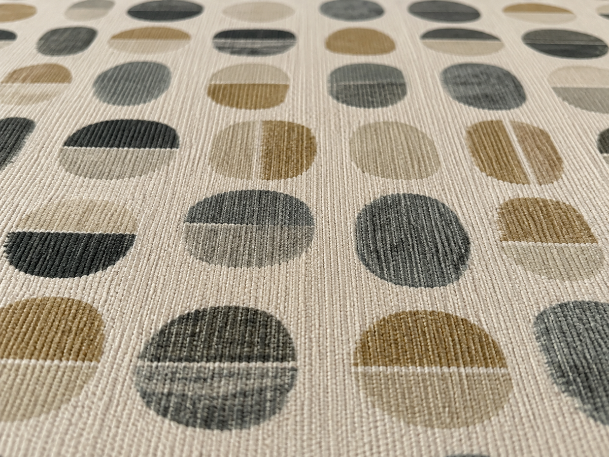 Close-up of the grey split pebble outdoor rug — short, dense low-pile chenille nap