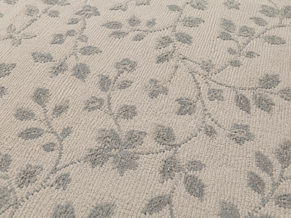 Close-up of the grey trailing vine outdoor rug — short, dense low-pile chenille nap