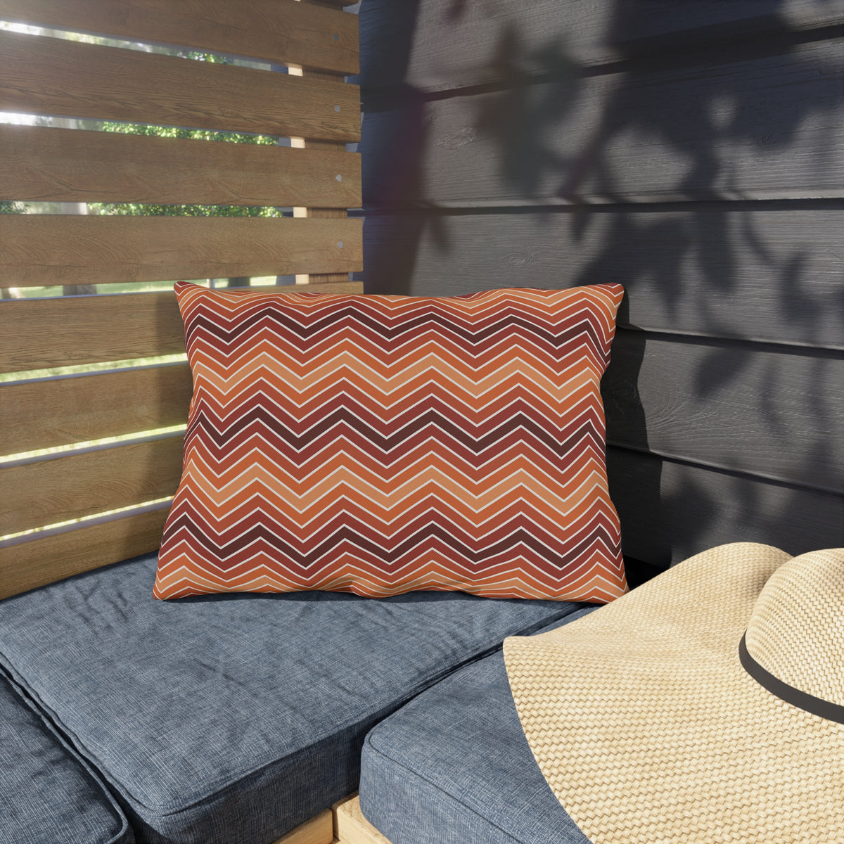 Rust chevron lumbar outdoor pillow — spun polyester, UV and water resistant