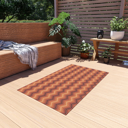 Rust chevron outdoor rug — soft polyester chenille with a non-slip backing