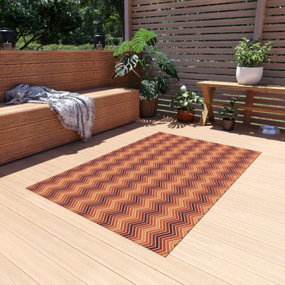 Rust chevron outdoor rug — soft polyester chenille with a non-slip backing