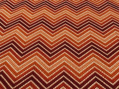 Rust chevron outdoor rug — soft polyester chenille with a non-slip backing