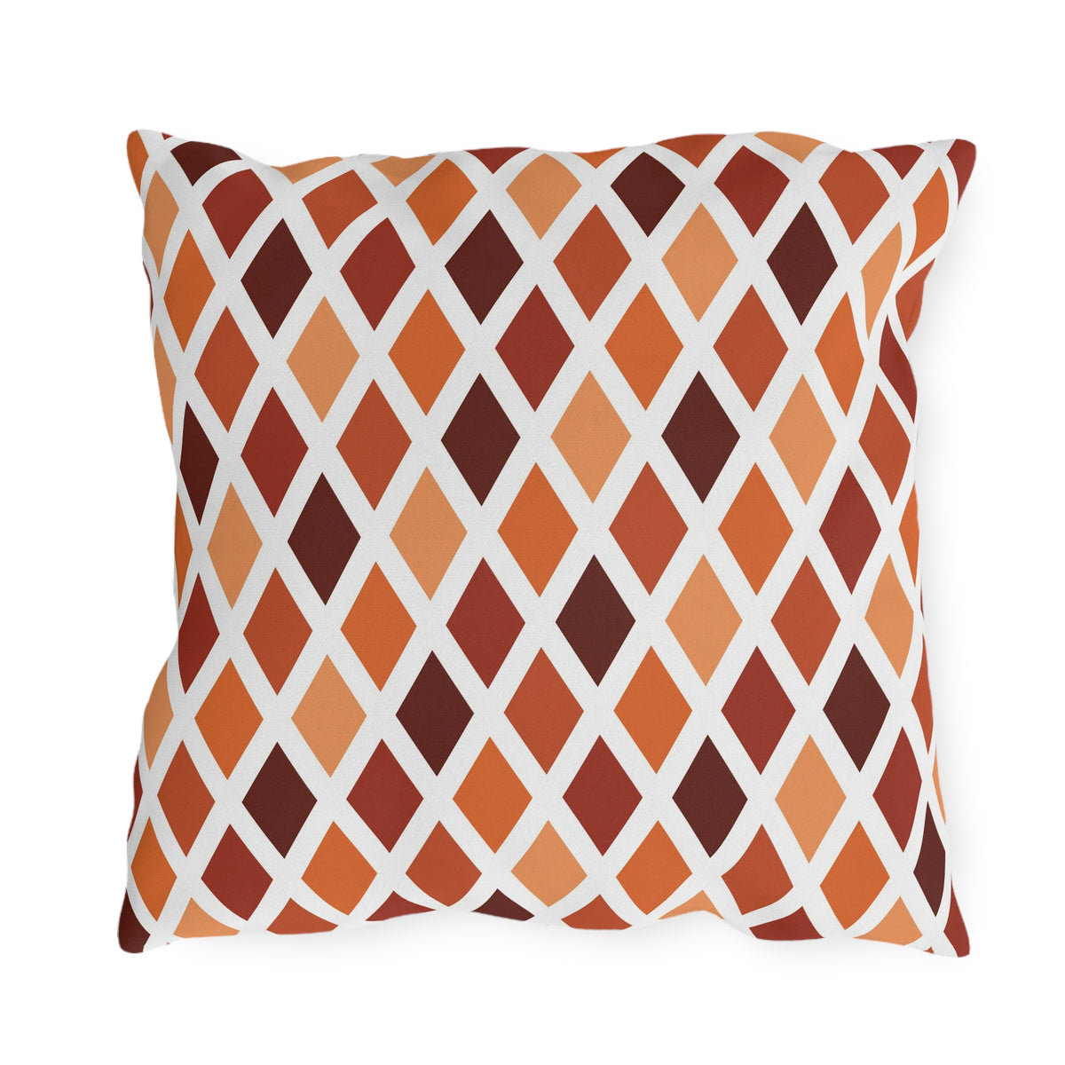 Rust harlequin diamond outdoor pillow — spun polyester, UV and water resistant
