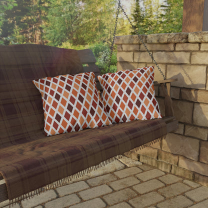 Rust harlequin diamond outdoor pillow — spun polyester, UV and water resistant