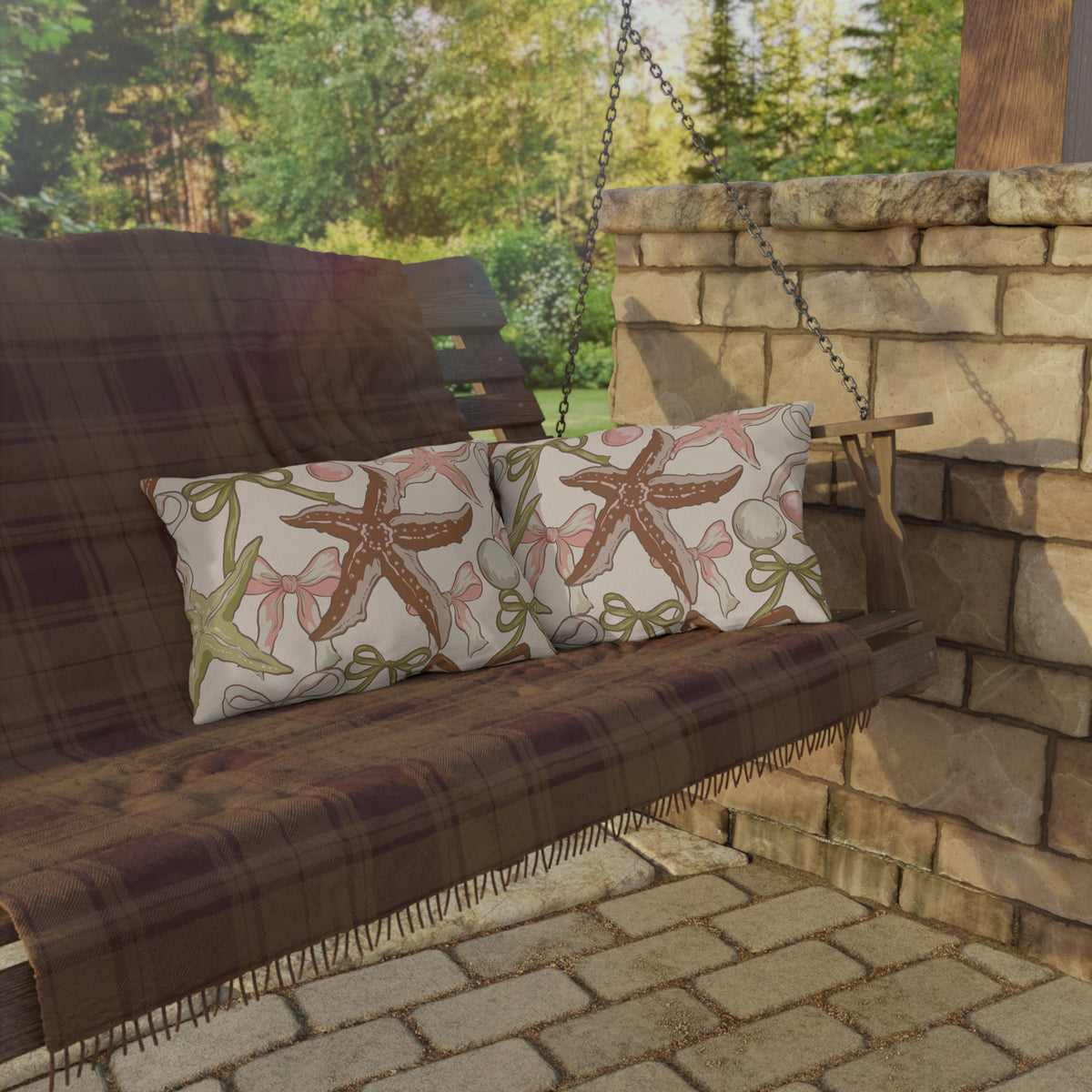Sage starfish and bow lumbar outdoor pillow — spun polyester, UV and water resistant