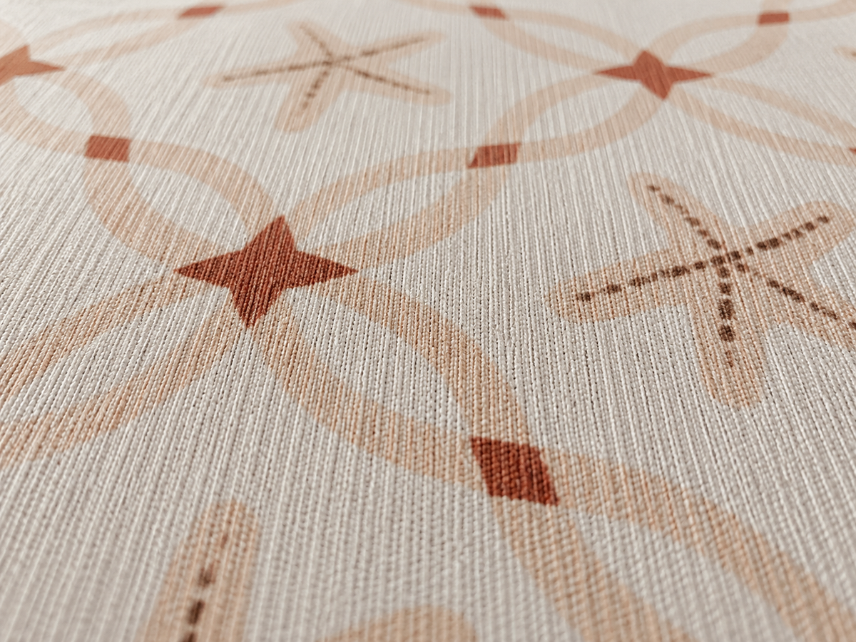 Close-up of the terracotta starfish lattice outdoor rug — short, dense low-pile chenille nap