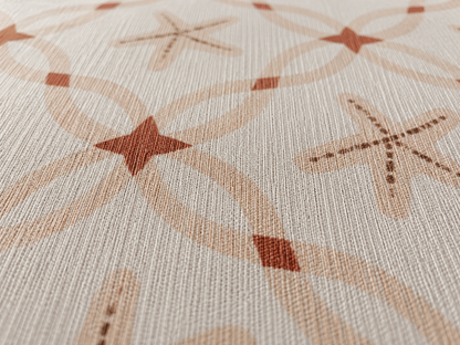 Close-up of the terracotta starfish lattice outdoor rug — short, dense low-pile chenille nap